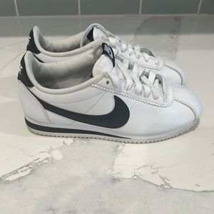 Nike White Sneakers with Classic Design and Large Swoosh Logo